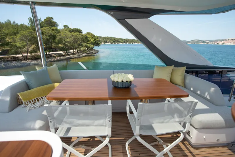 Prewi Yacht Photos Pics Luxurious Azimut 78 FLY yacht deck with elegant seating and scenic ocean view, 2022 model.