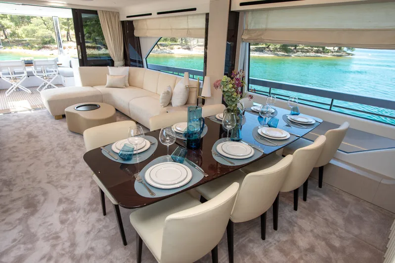 Prewi Yacht Photos Pics Luxurious interior of 2022 Azimut 78 FLY yacht with elegant dining area and scenic views.