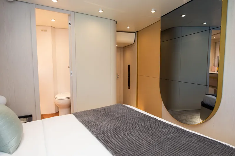 Prewi Yacht Photos Pics Luxurious bedroom interior of 2022 Azimut 78 FLY yacht with modern design and ensuite bathroom.