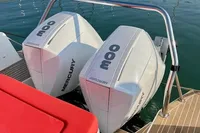 Twin Mercury 300 outboard engines on a 2023 Nimbus T 11 boat at a marina.