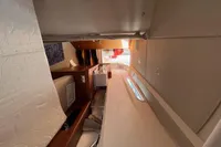 Interior cabin of 2023 Nimbus T 11 boat, featuring cozy sleeping area and modern design.