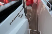 2023 Nimbus T 11 boat interior with sleek design and red seating.