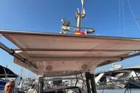 2023 Nimbus T 11 boat with canopy and radar, docked in a marina.
