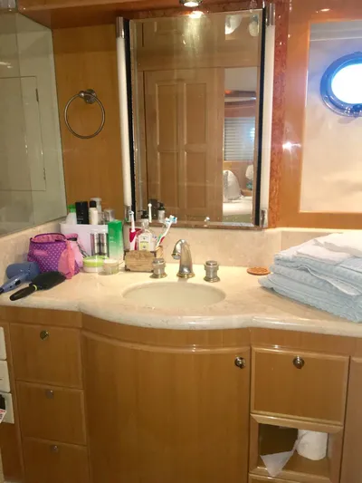  Yacht Photos Pics Luxurious bathroom in a 2004 McKinna 58 yacht with modern amenities and elegant design.