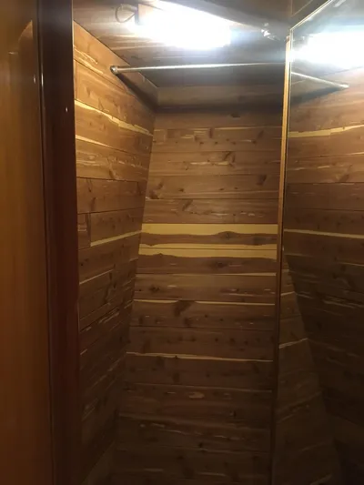  Yacht Photos Pics Wood-paneled closet interior on a 2004 McKinna 58 yacht.