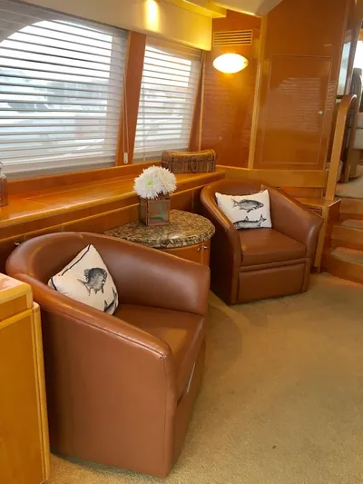  Yacht Photos Pics Luxurious 2004 McKinna 58 yacht interior with leather chairs and elegant decor.