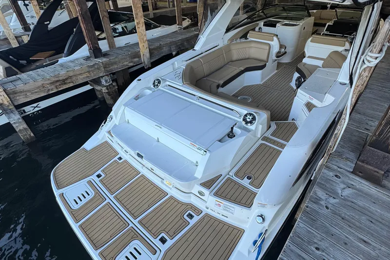  Yacht Photos Pics 2020 Sea Ray SLX 350 boat docked, featuring spacious seating and elegant design.