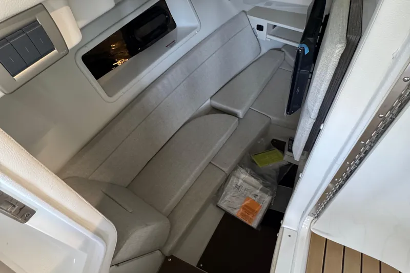  Yacht Photos Pics 2020 Sea Ray SLX 350 cabin interior with beige seating and modern design.