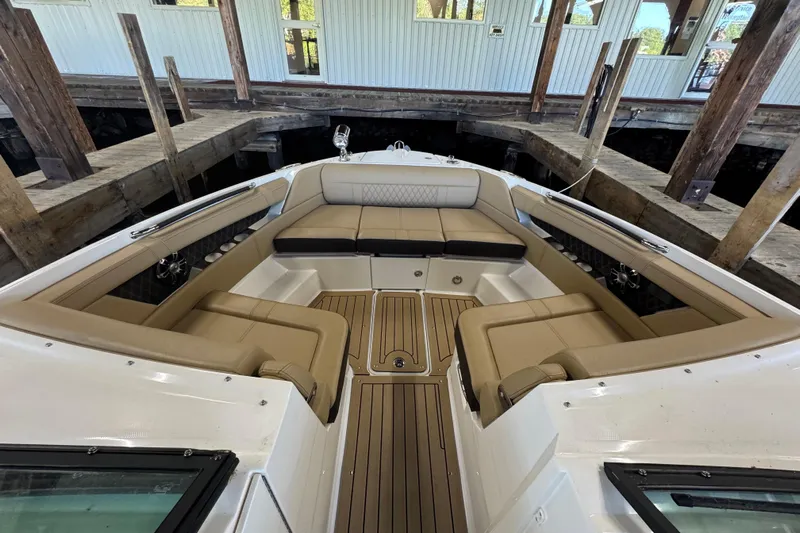  Yacht Photos Pics 2020 Sea Ray SLX 350 boat interior with tan seating and wood accents.