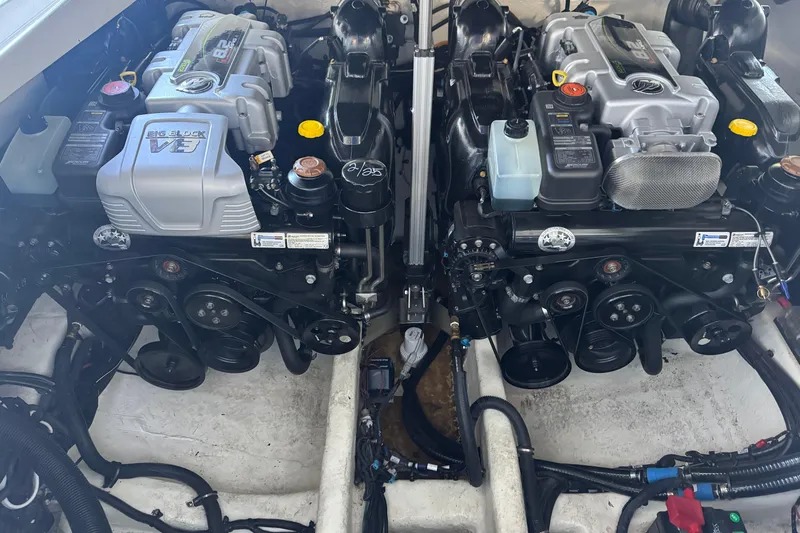  Yacht Photos Pics Twin engines of a 2020 Sea Ray SLX 350 boat, showcasing powerful machinery.