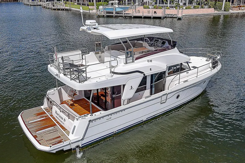 Horizon IV Yacht Photos Pics 2020 Beneteau Swift Trawler 47 on water, showcasing sleek design and spacious deck.