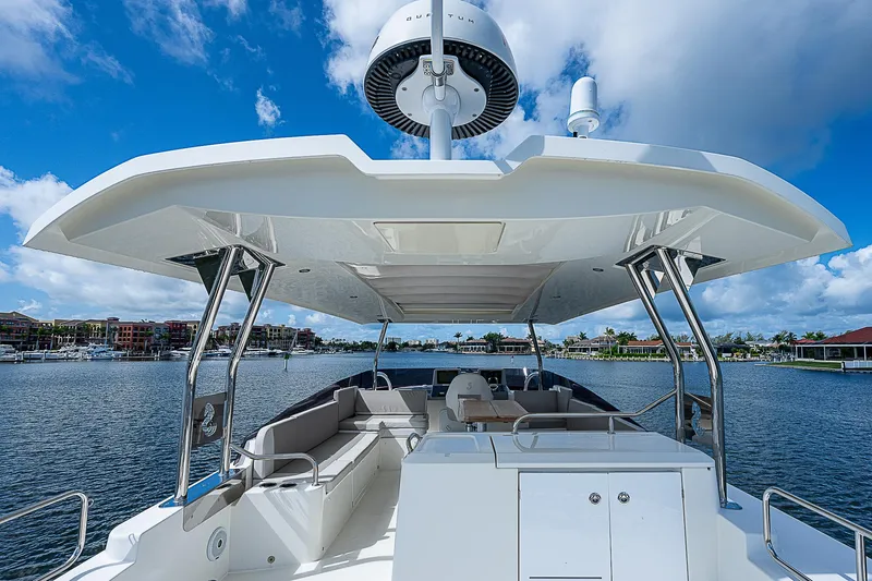 Horizon IV Yacht Photos Pics 2020 Beneteau Swift Trawler 47, spacious deck, modern design, scenic waterfront view.