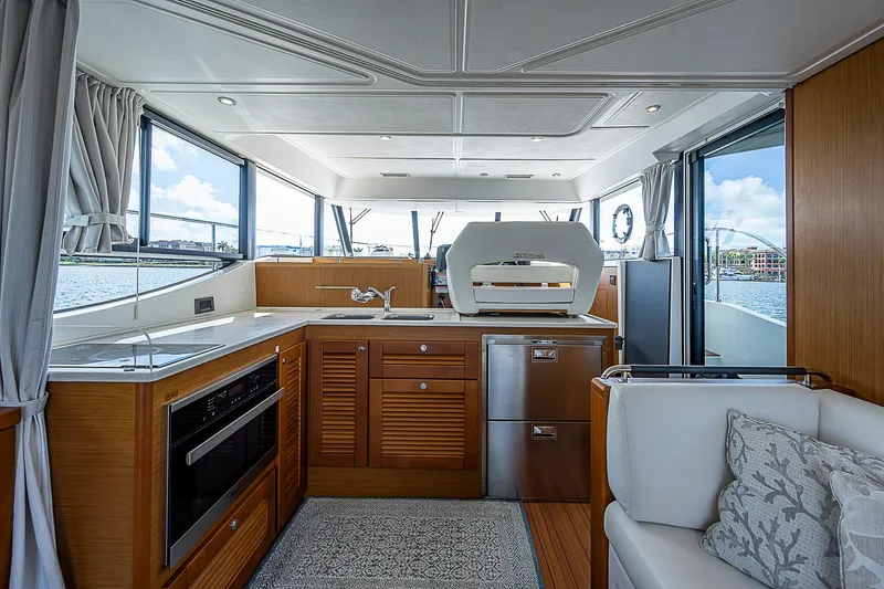 Horizon IV Yacht Photos Pics Interior of 2020 Beneteau Swift Trawler 47, featuring modern kitchen and seating area.