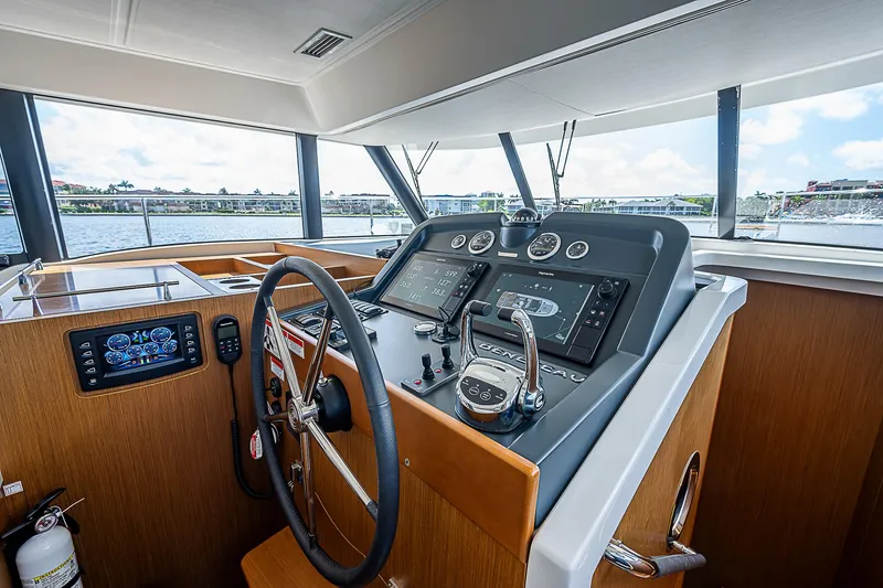 Horizon IV Yacht Photos Pics 2020 Beneteau Swift Trawler 47 helm with modern navigation equipment and steering wheel.