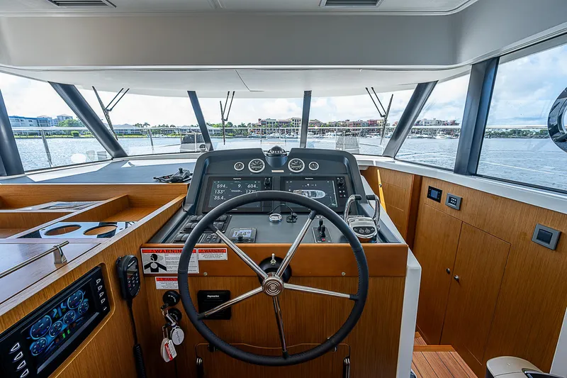 Horizon IV Yacht Photos Pics 2020 Beneteau Swift Trawler 47 helm with panoramic view and modern controls.