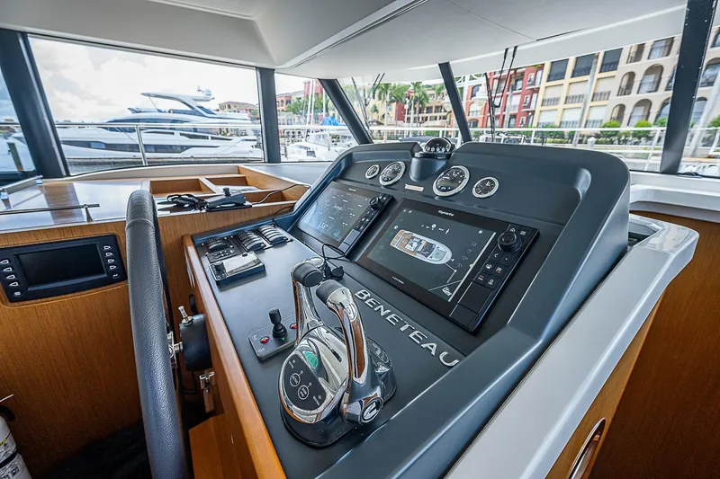 Horizon IV Yacht Photos Pics 2020 Beneteau Swift Trawler 47 helm with modern navigation controls and waterfront view.