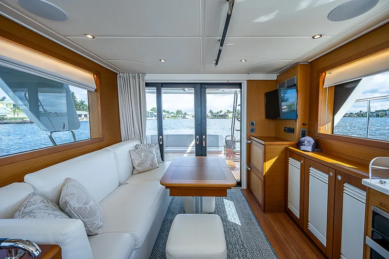Horizon IV Yacht Photos Pics 2020 Beneteau Swift Trawler 47 interior with elegant seating and dining area.