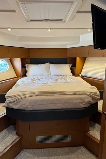Horizon IV Yacht Photos Pics Luxurious bedroom interior of 2020 Beneteau Swift Trawler 47 with cozy bedding.