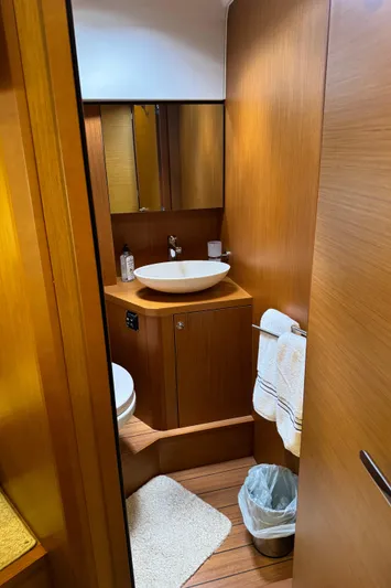 Horizon IV Yacht Photos Pics 2020 Beneteau Swift Trawler 47 bathroom with wooden cabinetry and modern sink.