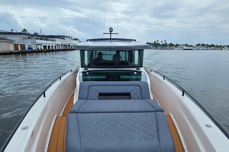 Stardust Yacht Photos Pics 2021 Axopar 37 XC Cross Cabin boat on calm waters, featuring luxurious seating.