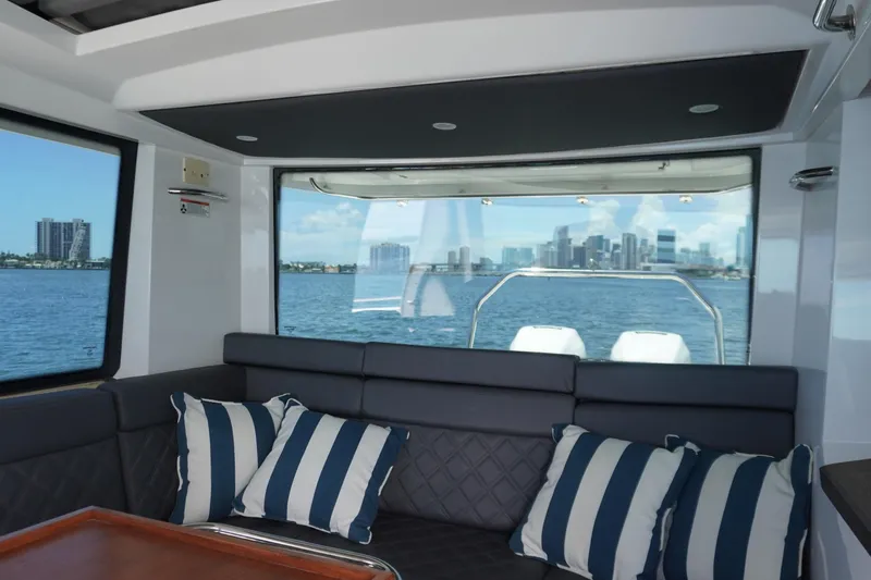 Stardust Yacht Photos Pics Interior of 2021 Axopar 37 XC Cross Cabin with city skyline view.