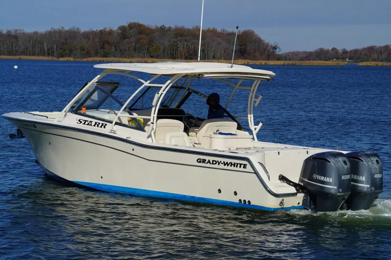 Starr Yacht Photos Pics 2015 Grady-White Freedom 307 boat on water with Yamaha engines.