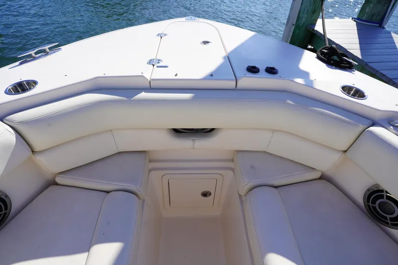 Starr Yacht Photos Pics 2015 Grady-White Freedom 307 boat interior with cushioned seating and cup holders.