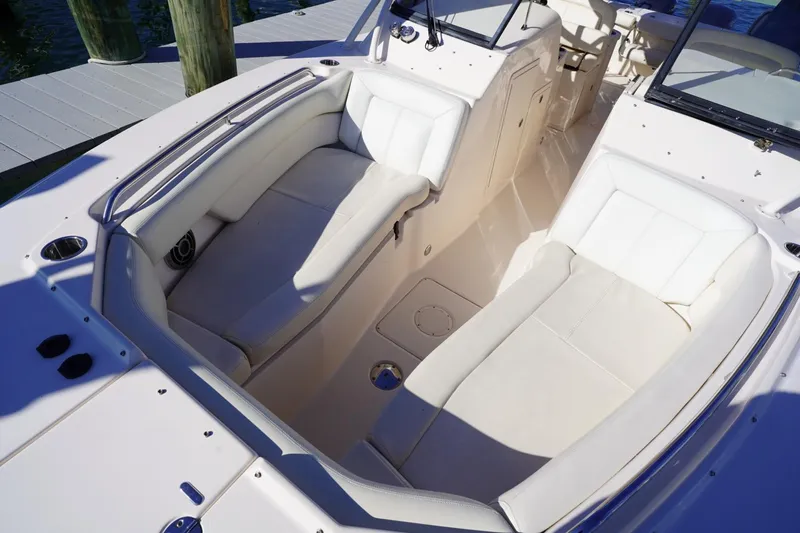 Starr Yacht Photos Pics 2015 Grady-White Freedom 307 boat interior with white cushioned seating.