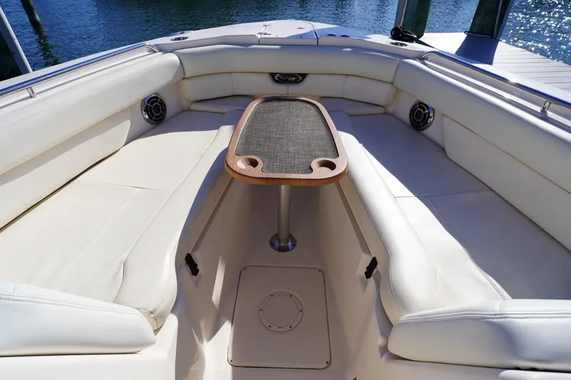 Starr Yacht Photos Pics Luxurious seating area on 2015 Grady-White Freedom 307 boat with table.