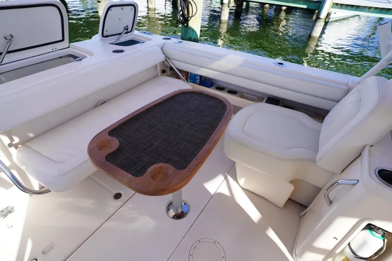 Starr Yacht Photos Pics Interior of 2015 Grady-White Freedom 307 boat with seating and table.
