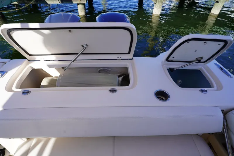 Starr Yacht Photos Pics 2015 Grady-White Freedom 307 boat storage compartments open by the water.