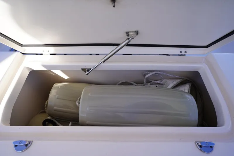 Starr Yacht Photos Pics Storage compartment on 2015 Grady-White Freedom 307 boat with fenders and ropes.