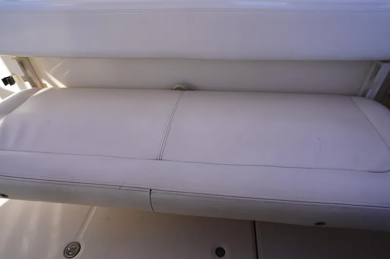 Starr Yacht Photos Pics 2015 Grady-White Freedom 307 boat seat, white upholstery, close-up view.