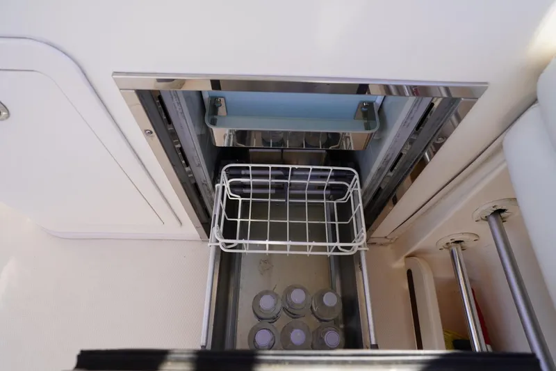 Starr Yacht Photos Pics Built-in cooler on 2015 Grady-White Freedom 307 boat with water bottles inside.