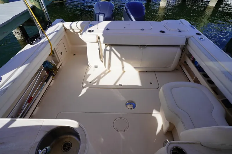 Starr Yacht Photos Pics 2015 Grady-White Freedom 307 boat interior with seating and storage compartments.