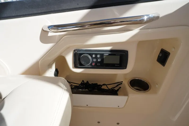 Starr Yacht Photos Pics 2015 Grady-White Freedom 307 boat interior with Fusion stereo system and cup holder.