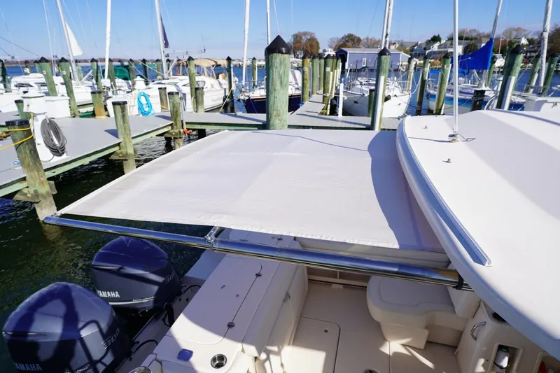 Starr Yacht Photos Pics 2015 Grady-White Freedom 307 boat docked with sunshade and twin Yamaha engines.