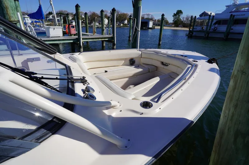 Starr Yacht Photos Pics 2015 Grady-White Freedom 307 boat docked, featuring spacious seating and sleek design.