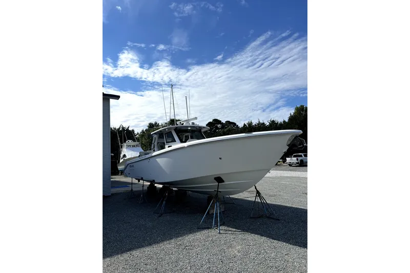 Game Changer Yacht Photos Pics 2022 Solace 41CS boat on stands under a clear blue sky.