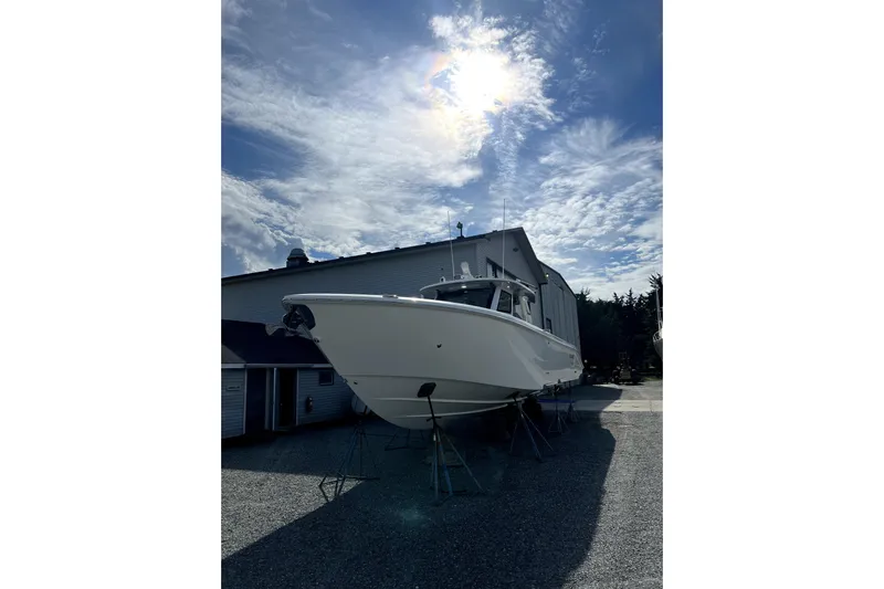Game Changer Yacht Photos Pics 2022 Solace 41CS boat on stands under a bright sky.