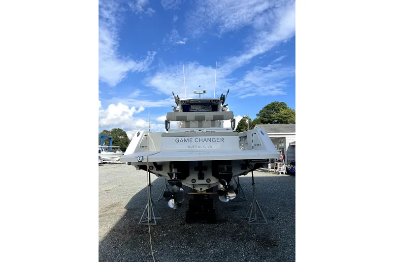 Game Changer Yacht Photos Pics 2022 Solace 41CS boat, rear view, on land under a clear blue sky.
