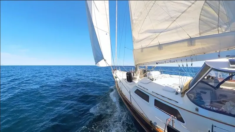  Yacht Photos Pics 1984 Irwin Cutter Ketch sailing on open sea under clear blue sky.