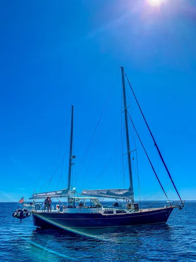  Yacht Photos Pics 1984 Irwin Cutter Ketch sailboat on calm blue sea under clear sky.