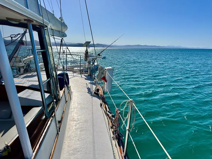  Yacht Photos Pics 1984 Irwin Cutter Ketch sailing on clear blue waters under a sunny sky.