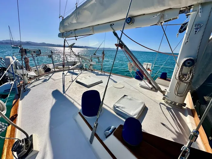  Yacht Photos Pics 1984 Irwin Cutter Ketch sailboat deck with ocean view and clear skies.