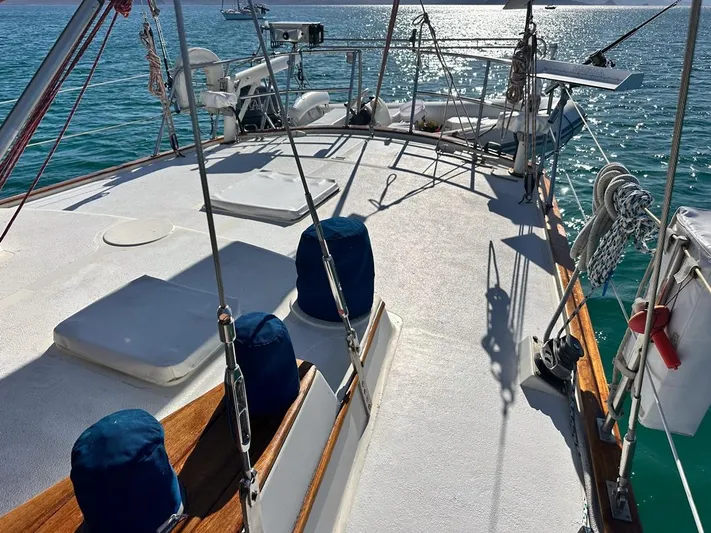  Yacht Photos Pics 1984 Irwin Cutter Ketch sailboat deck with ocean view and clear skies.