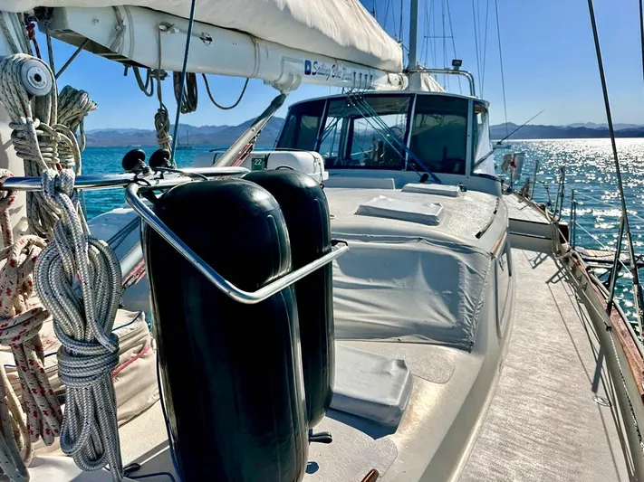  Yacht Photos Pics 1984 Irwin Cutter Ketch sailboat on sunny ocean waters, showcasing deck and rigging.