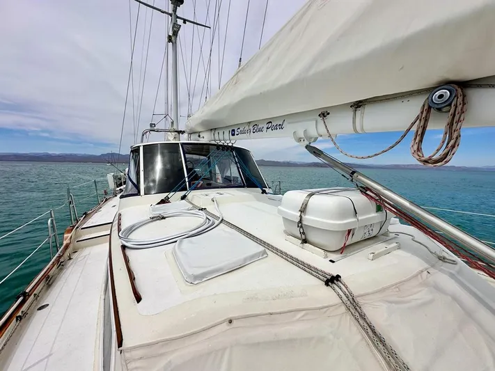  Yacht Photos Pics 1984 Irwin Cutter Ketch sailboat on calm sea, showcasing deck and rigging.