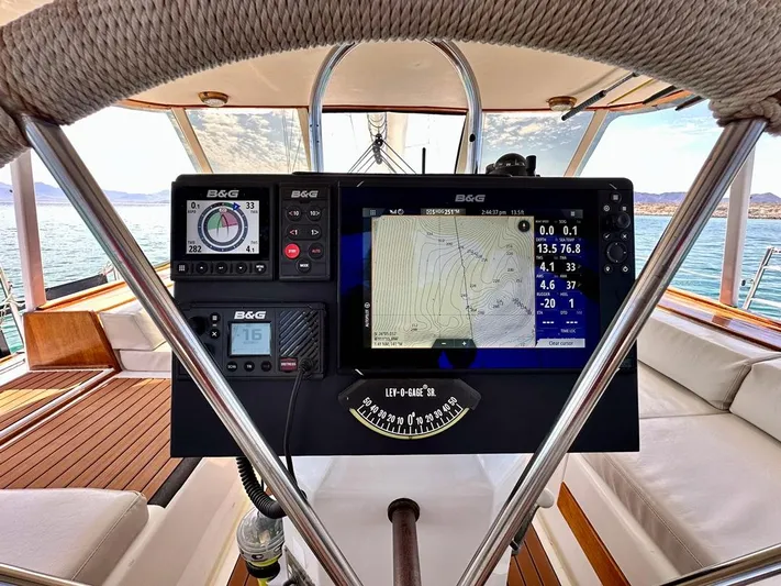  Yacht Photos Pics Cockpit view of 1984 Irwin Cutter Ketch with navigation instruments and ocean backdrop.