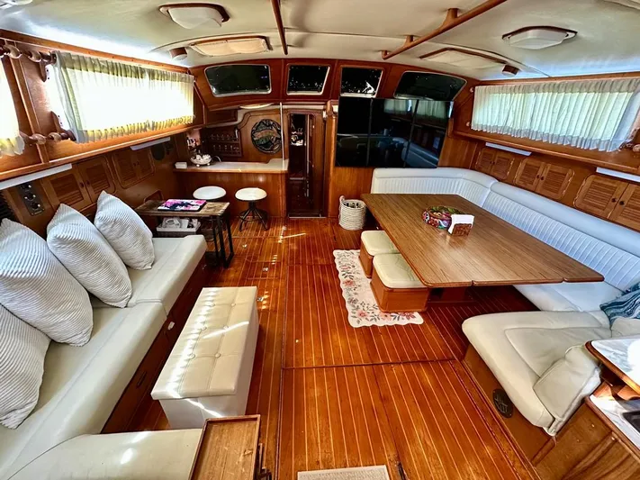  Yacht Photos Pics Luxurious 1984 Irwin Cutter Ketch yacht interior with elegant wood finish and comfortable seating.